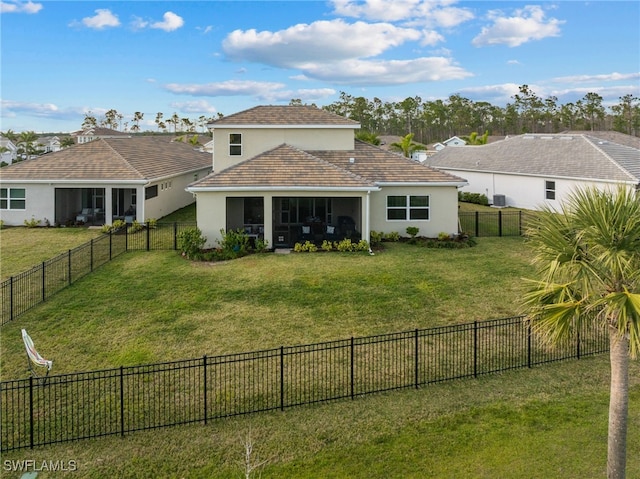 back of property featuring a lawn