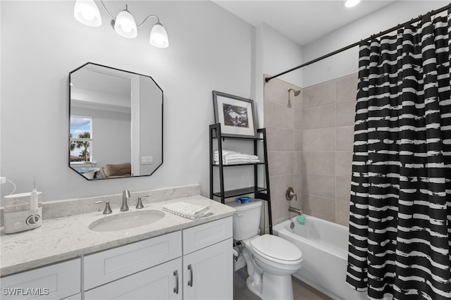 full bathroom with vanity, shower / bath combo, and toilet