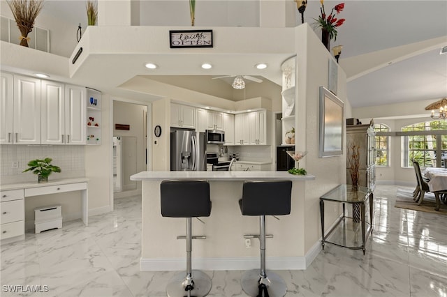 kitchen with stainless steel appliances, a peninsula, marble finish floor, open shelves, and tasteful backsplash