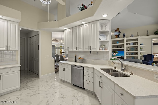 kitchen featuring a sink, marble finish floor, white cabinetry, and dishwasher