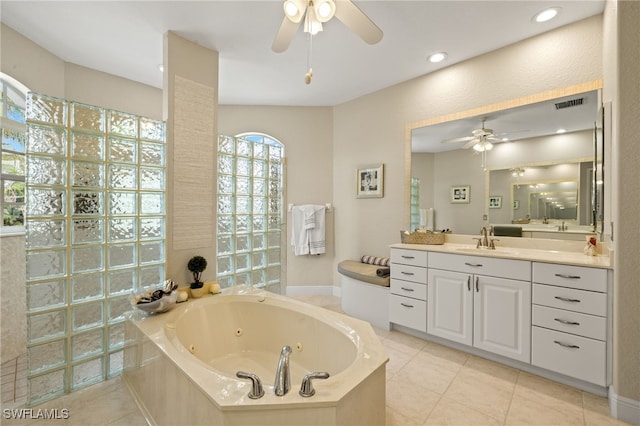 full bath with a whirlpool tub, tile patterned flooring, visible vents, and vanity