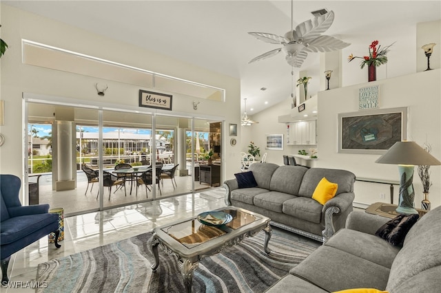 living room with ceiling fan and high vaulted ceiling