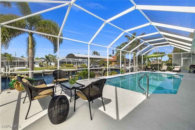 outdoor pool with a lanai and a patio