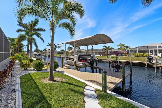 view of dock with a yard, boat lift, a water view, glass enclosure, and a residential view