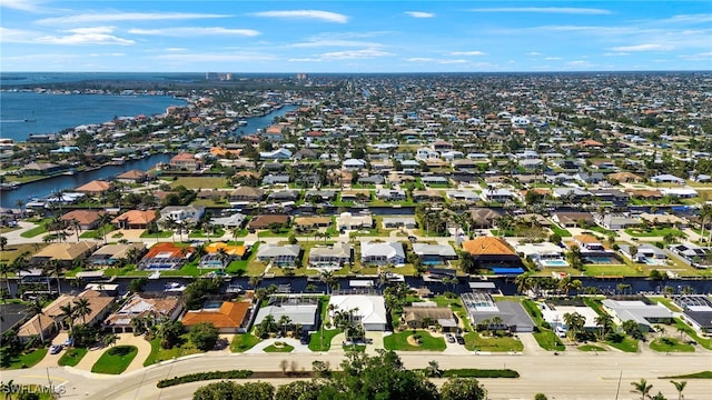 aerial view featuring a residential view and a water view