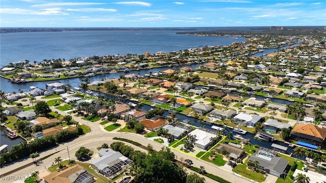 aerial view with a residential view and a water view