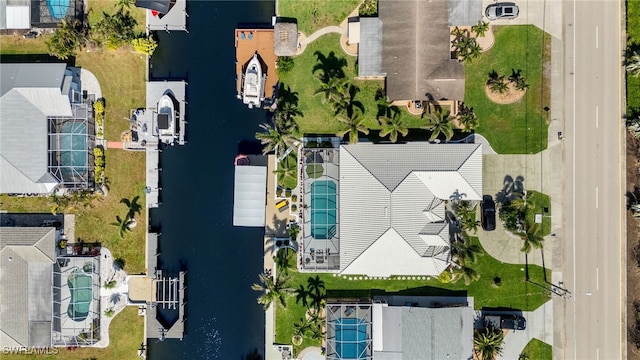 aerial view with a residential view and a water view