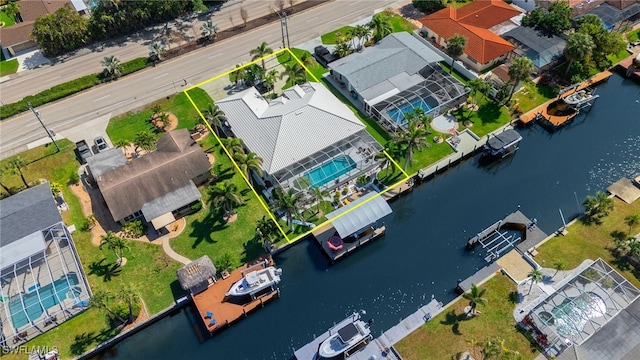 bird's eye view with a water view and a residential view