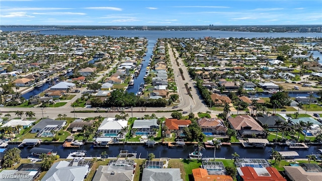 bird's eye view with a water view and a residential view