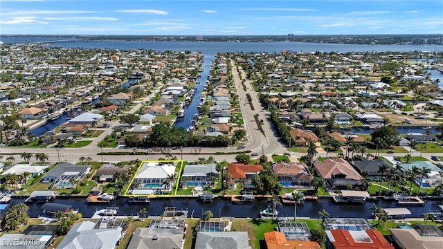 birds eye view of property with a residential view and a water view