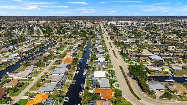 aerial view featuring a water view and a residential view