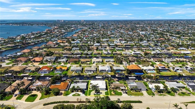 aerial view with a residential view and a water view