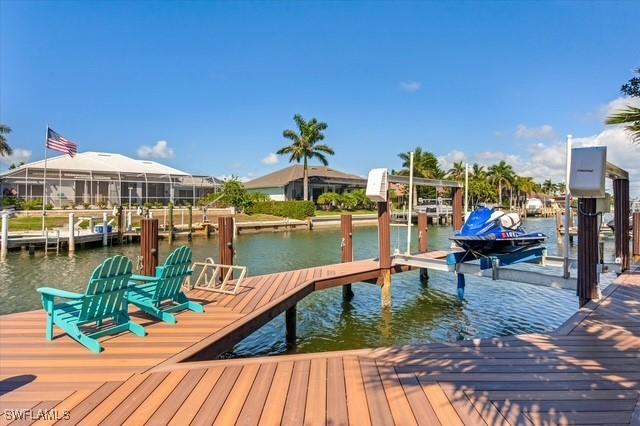 dock area featuring a water view and boat lift