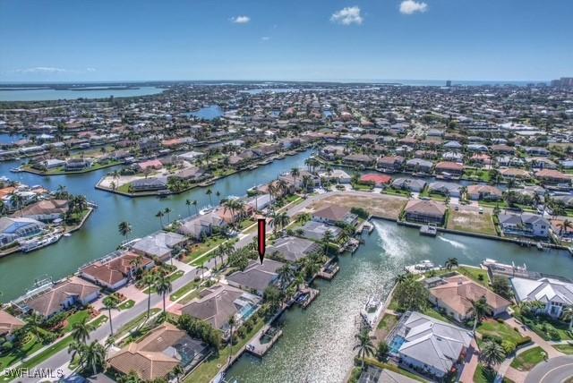 bird's eye view featuring a water view and a residential view