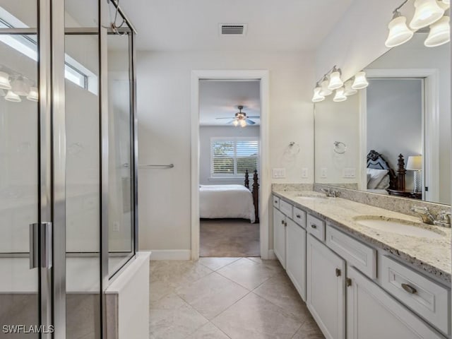 17183 Ashford Ter, Fort Myers, FL 33967 - bathroom featuring a shower with door, tile patterned flooring, ceiling fan, and vanity