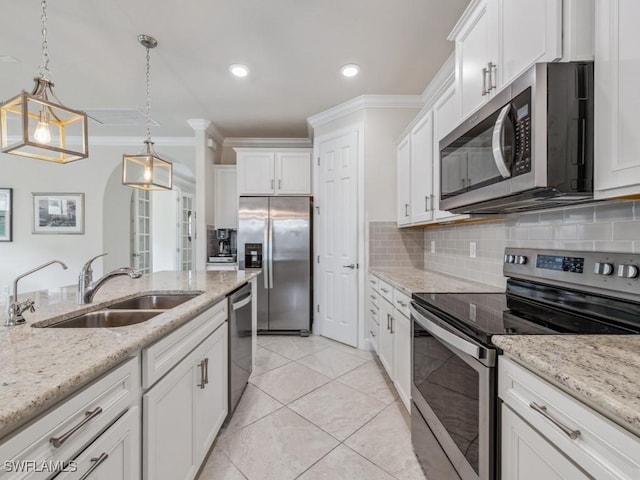 17183 Ashford Ter, Fort Myers, FL 33967 - kitchen featuring hanging light fixtures, stainless steel appliances, light stone countertops, sink, and white cabinetry