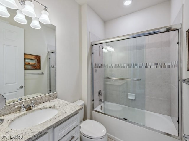 17183 Ashford Ter, Fort Myers, FL 33967 - full bathroom with enclosed tub / shower combo, vanity, and toilet