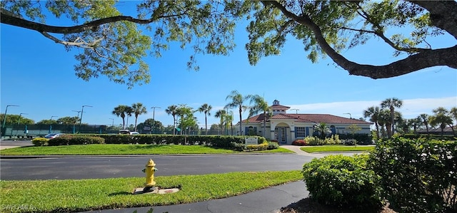 23861 Costa Del Sol Rd Unit 203, Estero, FL 34135 - view of asphalt road with street lighting, curbs, and sidewalks
