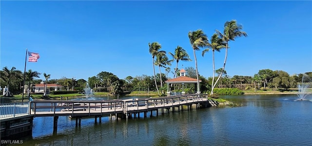 23861 Costa Del Sol Rd Unit 203, Estero, FL 34135 - dock featuring a water view, a gazebo, and view of scattered trees