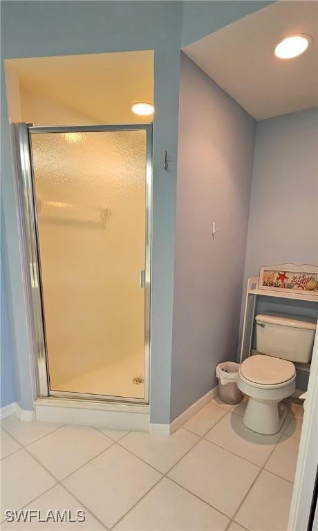 23861 Costa Del Sol Rd Unit 203, Estero, FL 34135 - full bath with toilet, a shower stall, tile patterned flooring, and baseboards