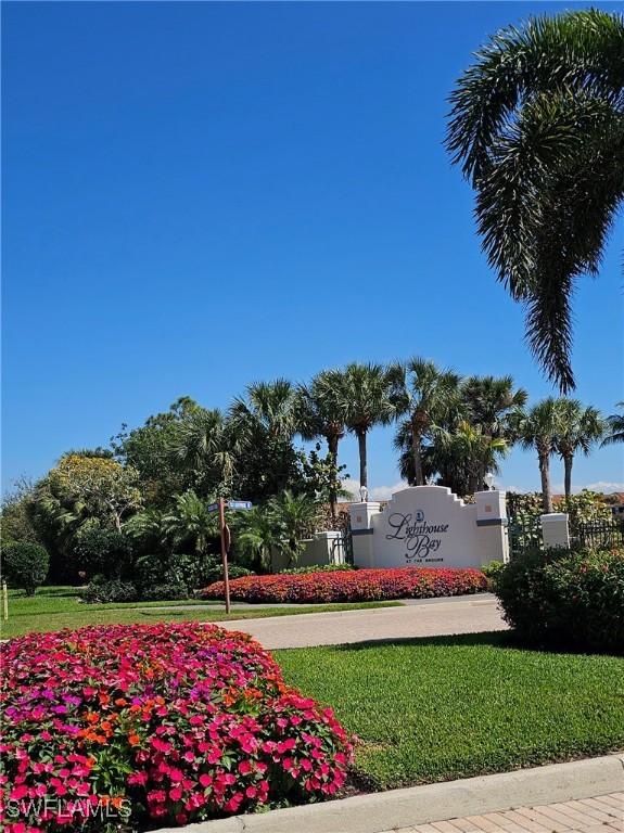 23861 Costa Del Sol Rd Unit 203, Estero, FL 34135 - community sign with a lawn