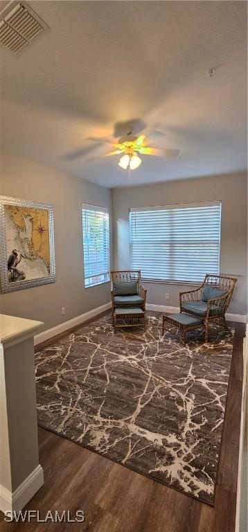 23861 Costa Del Sol Rd Unit 203, Estero, FL 34135 - sitting room featuring wood finished floors, baseboards, and ceiling fan