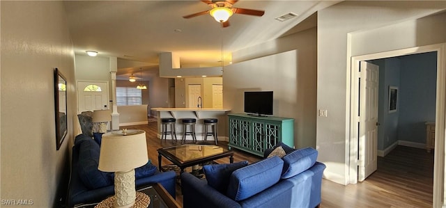 23861 Costa Del Sol Rd Unit 203, Estero, FL 34135 - living room featuring ceiling fan, wood finished floors, vaulted ceiling, and baseboards