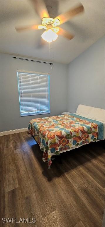 23861 Costa Del Sol Rd Unit 203, Estero, FL 34135 - bedroom featuring wood finished floors, a ceiling fan, and baseboards