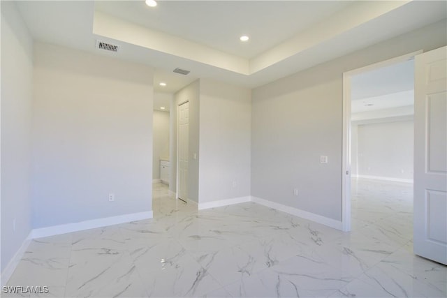 empty room with a tray ceiling