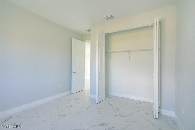 unfurnished bedroom with a closet