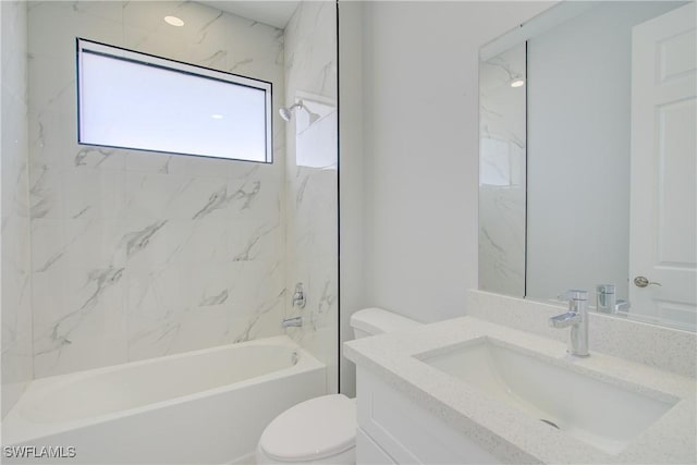 full bathroom featuring vanity, toilet, and tiled shower / bath combo