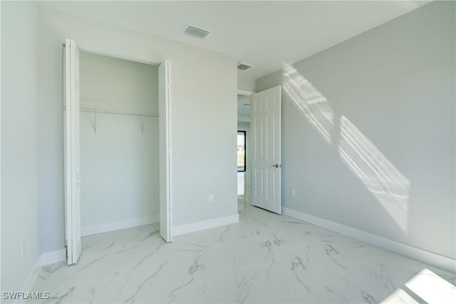 unfurnished bedroom with a closet