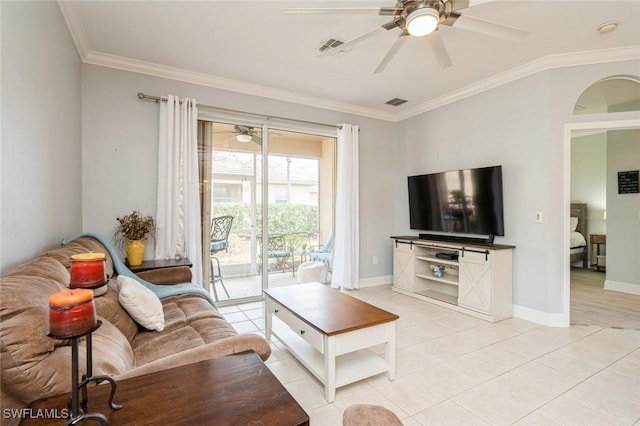 living room with ceiling fan, light tile patterned floors, and crown molding