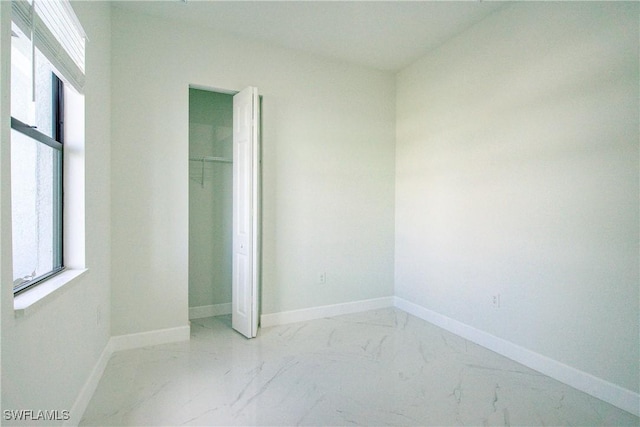 unfurnished bedroom featuring a closet