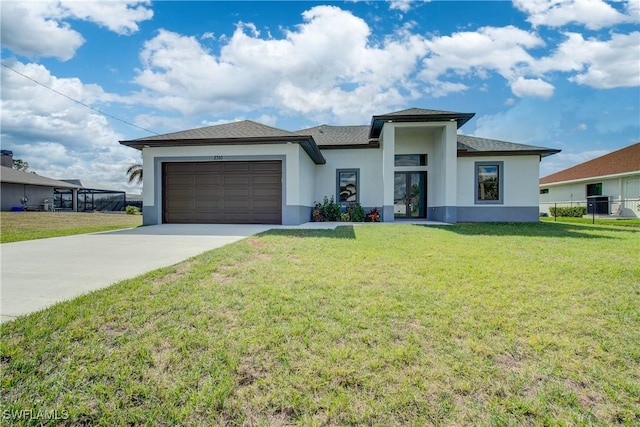 view of front of property featuring cooling unit, a garage, and a front lawn