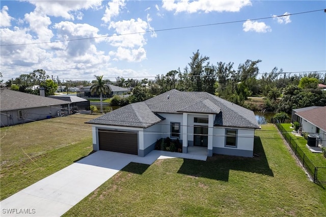 view of front facade with a garage and a front lawn