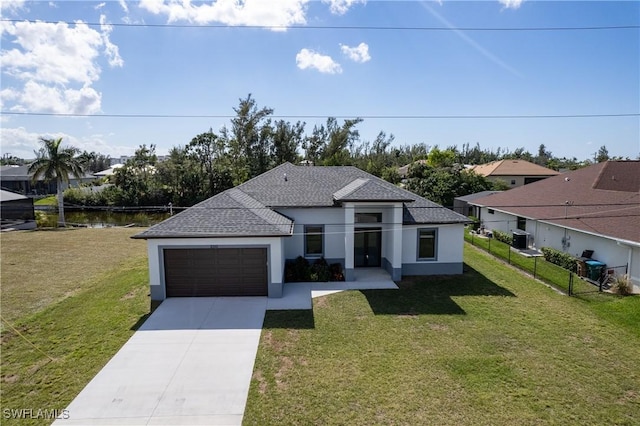 view of front facade featuring a garage and a front yard