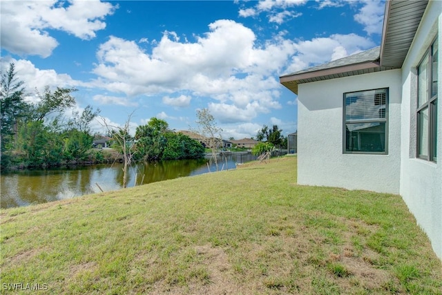 view of yard with a water view