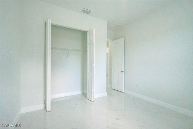 unfurnished bedroom featuring a closet