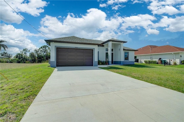 view of front of house with a garage and a front yard