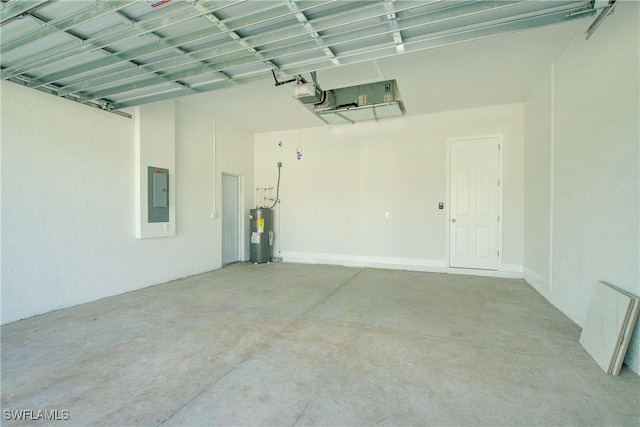 garage featuring water heater, a garage door opener, and electric panel