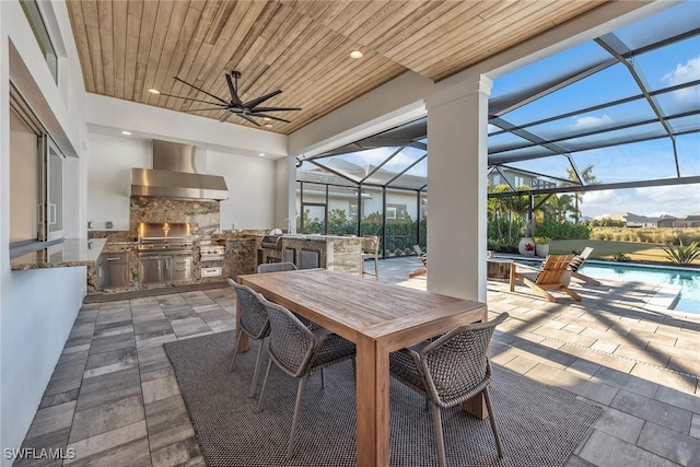 view of patio with area for grilling, glass enclosure, a grill, ceiling fan, and an outdoor pool