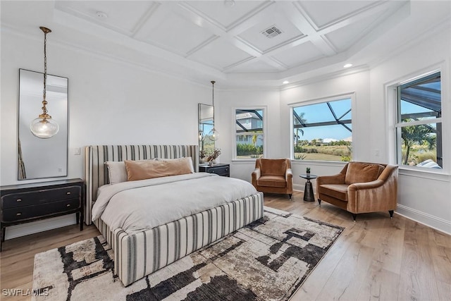 bedroom with multiple windows, coffered ceiling, wood finished floors, and baseboards