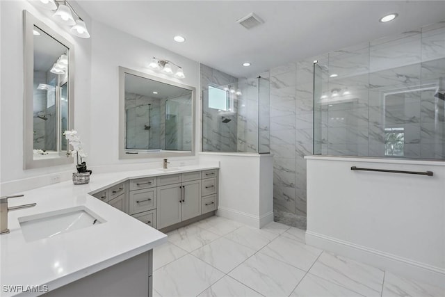 full bathroom with marble finish floor, a marble finish shower, visible vents, and recessed lighting