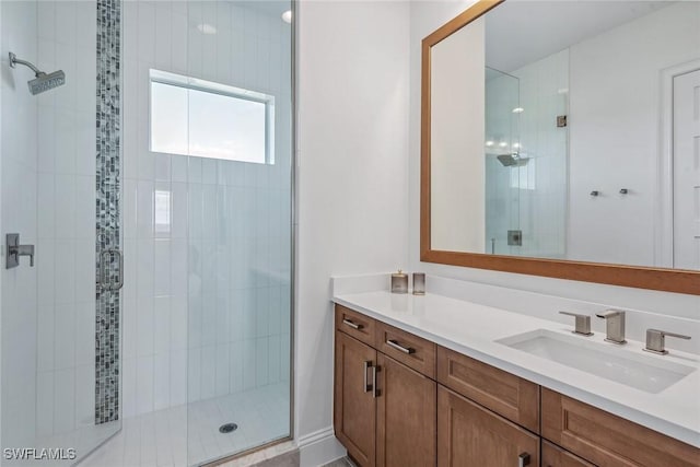 full bath featuring a stall shower and vanity