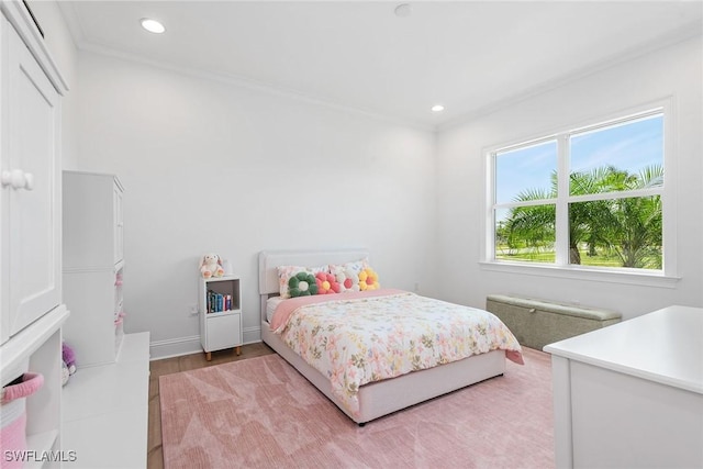 bedroom featuring baseboards, ornamental molding, and recessed lighting