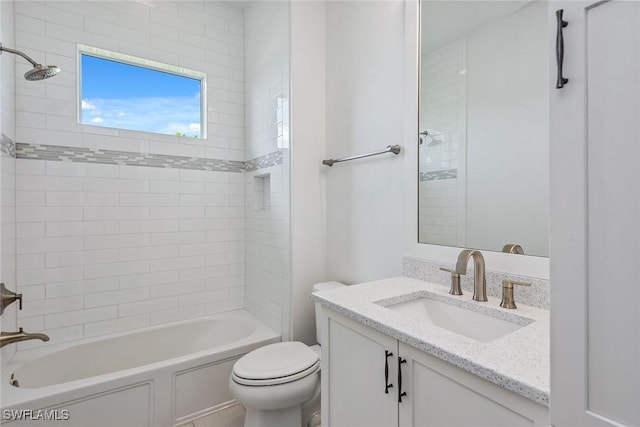 bathroom featuring bathtub / shower combination, vanity, and toilet