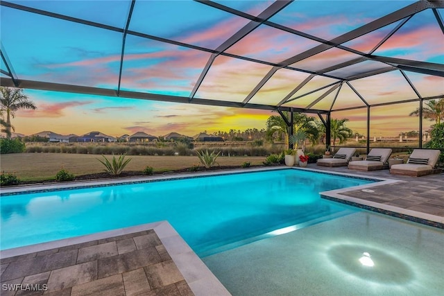 outdoor pool featuring a patio and a lanai