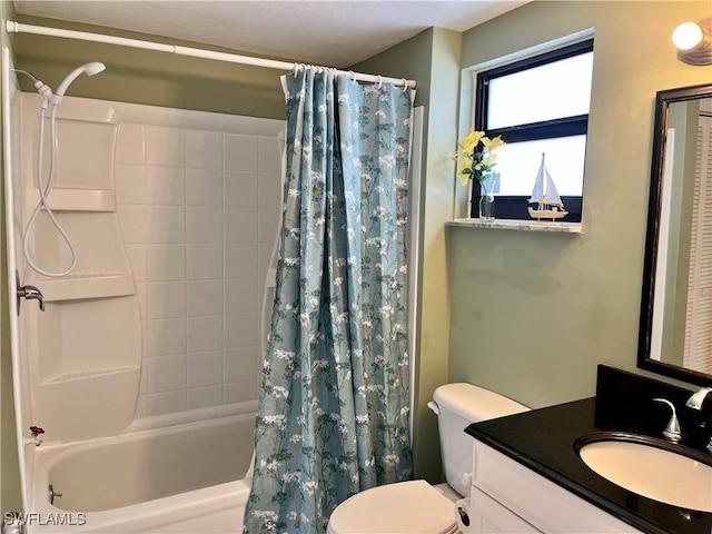 full bathroom featuring vanity, toilet, and shower / bath combo with shower curtain