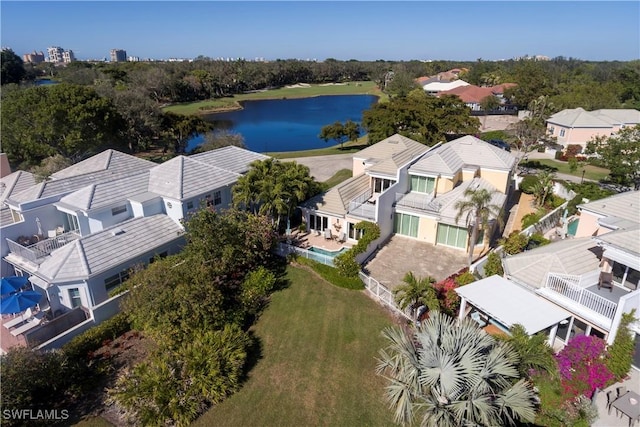 birds eye view of property with a water view and a residential view